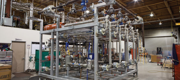 Industrial piping skid assembly in warehouse