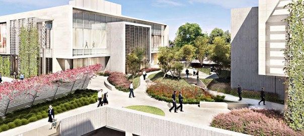 Modern landscaped campus courtyard with people walking